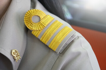 Closeup epaulet or shoulder strap on the shoulder of a Thai government teacher.  Civil Servant...
