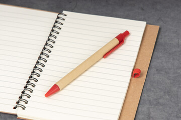 Set of recycle paper notebook and pen. Open diary notebook