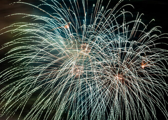 Naklejka premium Beautiful fireworks in night sky for New Year