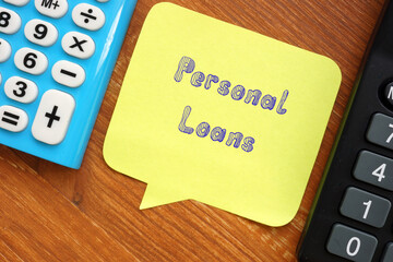 Business concept about Personal Loans with sign on the piece of paper.