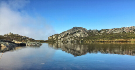 Mountain crystal clear lake in Harstad.