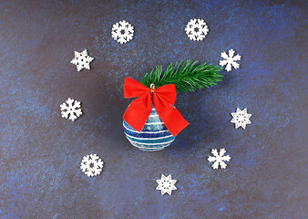 Beautiful dark Christmas background. Snowflakes. Christmas tree toy. Close-up. Top view.