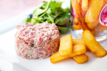 Tasty Steak tartare (Raw beef) - classic steak tartare on white plate