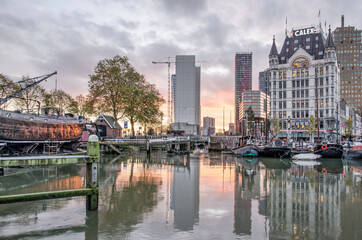 Rotterdam, The Netherlands, November 5, 2020: the famous White House reflecting in the water of the Old Harbour at sunset
