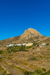 Fototapeta na wymiar Vertical view of the village of Volax on the Cycladic island of Tinos, Greece with a rocky mountain in the background