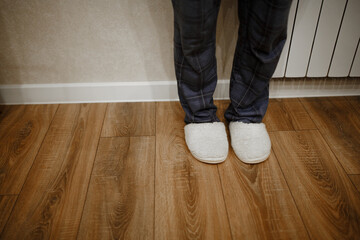 feet in slippers at home