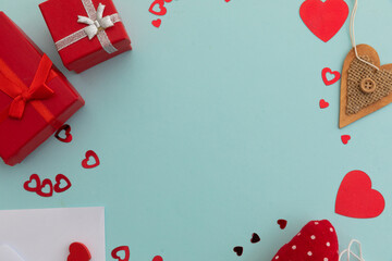 High angle view of red presents and hearts on blue background