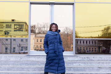 Obraz premium beautiful African American emerges from business center, in winter