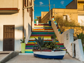 LAMPEDUSA, ITALY - Oct 22, 2020: colorful staircase in Lampedusa - obrazy, fototapety, plakaty