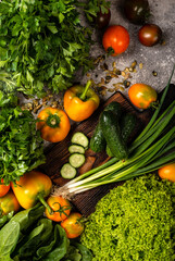 Different Vegetables and greens with chopping board