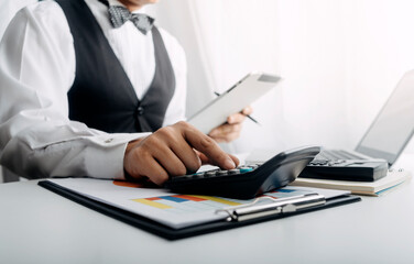 businesswoman hand using smart phone,mobile p payments online shopping,omni channel,digital tablet docking keyboard computer at office in sun light