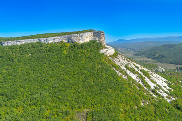 Picturesque mountain valley immersed in the greenery of the forest in Crimea near the city of Bakhchisarai 