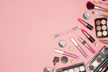 set of professional cosmetics, makeup tools and accessories on pink background, beauty, fashion, shopping concept, flat lay