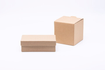 Two closed carton boxes of different shapes isolated on white