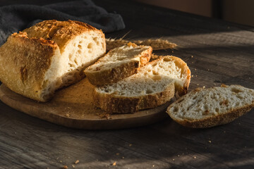 Various rustic bread on a wooden board. Healthy food and farming concept