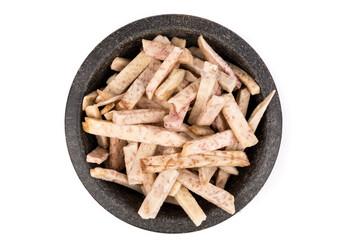 Dehydrated taro snack sticks in a bowl isolated over white