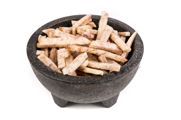 Dehydrated taro snack sticks in a bowl isolated over white