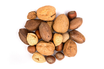 Pile of assorted nuts in the shell isolated over white top down view