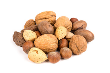 Pile of assorted nuts in the shell isolated over white
