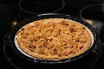Strawberry Rhubarb Holiday Pie on a Glass Stove Top