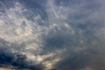 Fototapeta na wymiar Dark flying clouds in the sky