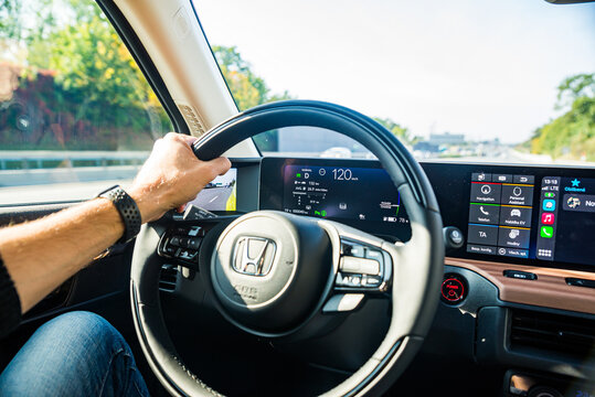 Prague, Czech republic - October 02, 2020. Yellow green electric Honda E - displays in the interior - speedometer, odometer