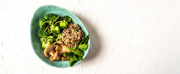 Gourmet salad mushrooms and broccoli and quinoa, Clean eating, dieting, vegan food concept. banner, catering menu recipe place for text, top view
