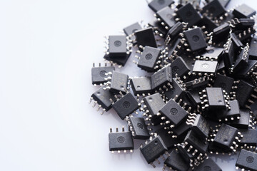 Pile of Integrated circuit chip on white background with copyspace. Microchip type soic8.