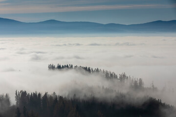 ground fog in valley, seen from mountain Pleschkogel near village Rein in Styria, Austria