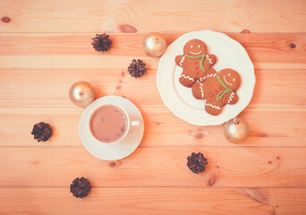 Christmas gingerbread men and cup of homemade hot chocolate.