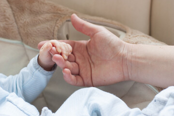 parent holding feet