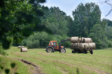 loading hay bales onto trailers