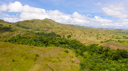 Fototapeta na wymiar Beautiful landscape on the island of Luzon, aerial view. Green hills and mountains.