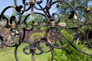 forged patterned lattice in the garden