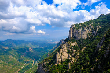 Picturesque view from Montserrat mountain to the cliffs and valley, near Santa Maria de Montserrat Benedictine Abbey, Catalonia, Barcelona, Spain