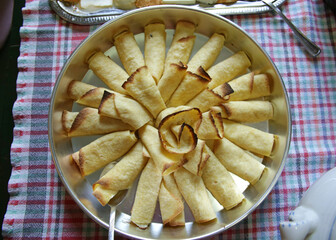 View from top of a small baking dish pies on the table with plaid tablecloth.Catering food, vegan, vegetarian food, top view, close up.