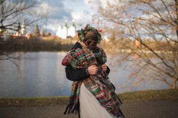 the bride hugs the groom the view from the back