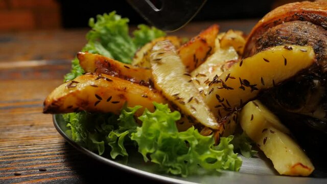 Baked potatoes with cumin