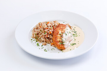 cutlet with buckwheat on the white background