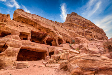 Fototapeta premium Petra,Jordan - October 23,2015: The rocky city of Petra. Red rocks and the rooms cut in them