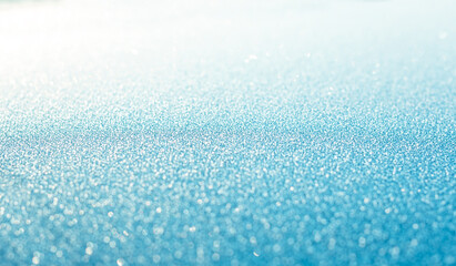 Blue snow sparkling festive background. Abstract 