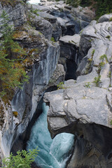 Fototapeta na wymiar Deep rock walls at Mistaya creek canyon