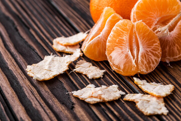 Mandarine orange or tangerine on wooden board