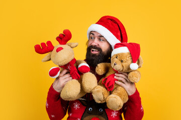 santa claus bearded man hold toy wish happy new year and merry christmas holiday ready to celebrate...