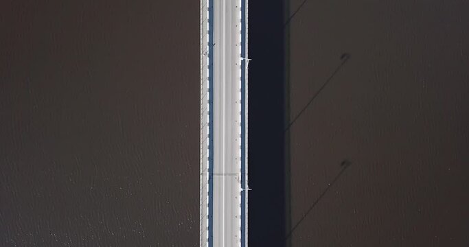 Aerial view of bridge stretching across Lake Ladoga. High quality 4k footage