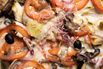 Delicious juicy pizza close-up. View from above.