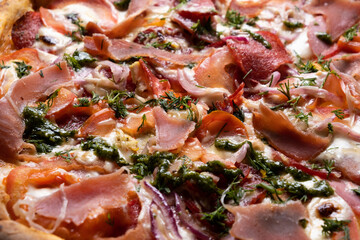Delicious juicy pizza close-up. View from above.
