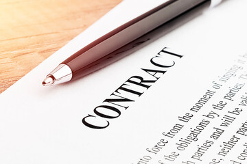 Legal contract signing - buy sell real estate contract. Close up.