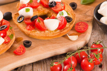 Friselle with tomatoes and mozzarella cheese.
