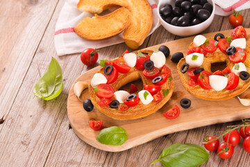 Friselle with tomatoes and mozzarella cheese.
